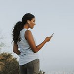 Cheerful woman using a mobile phone